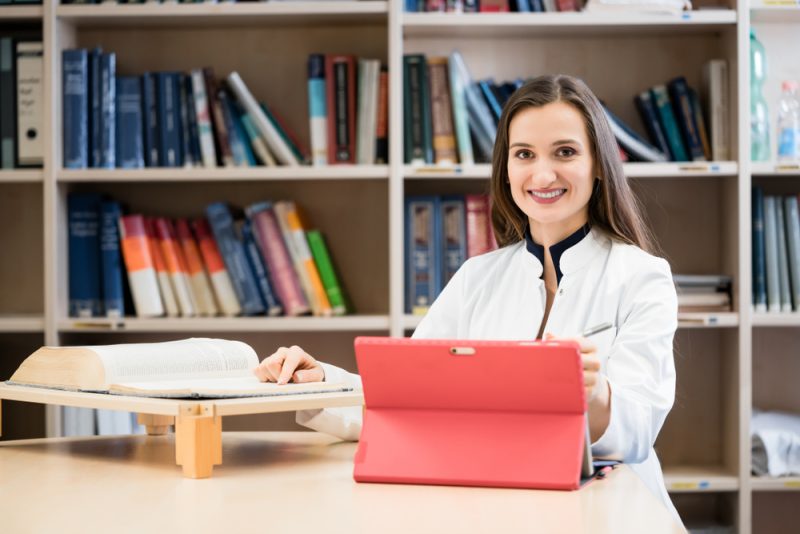 Medical student in library